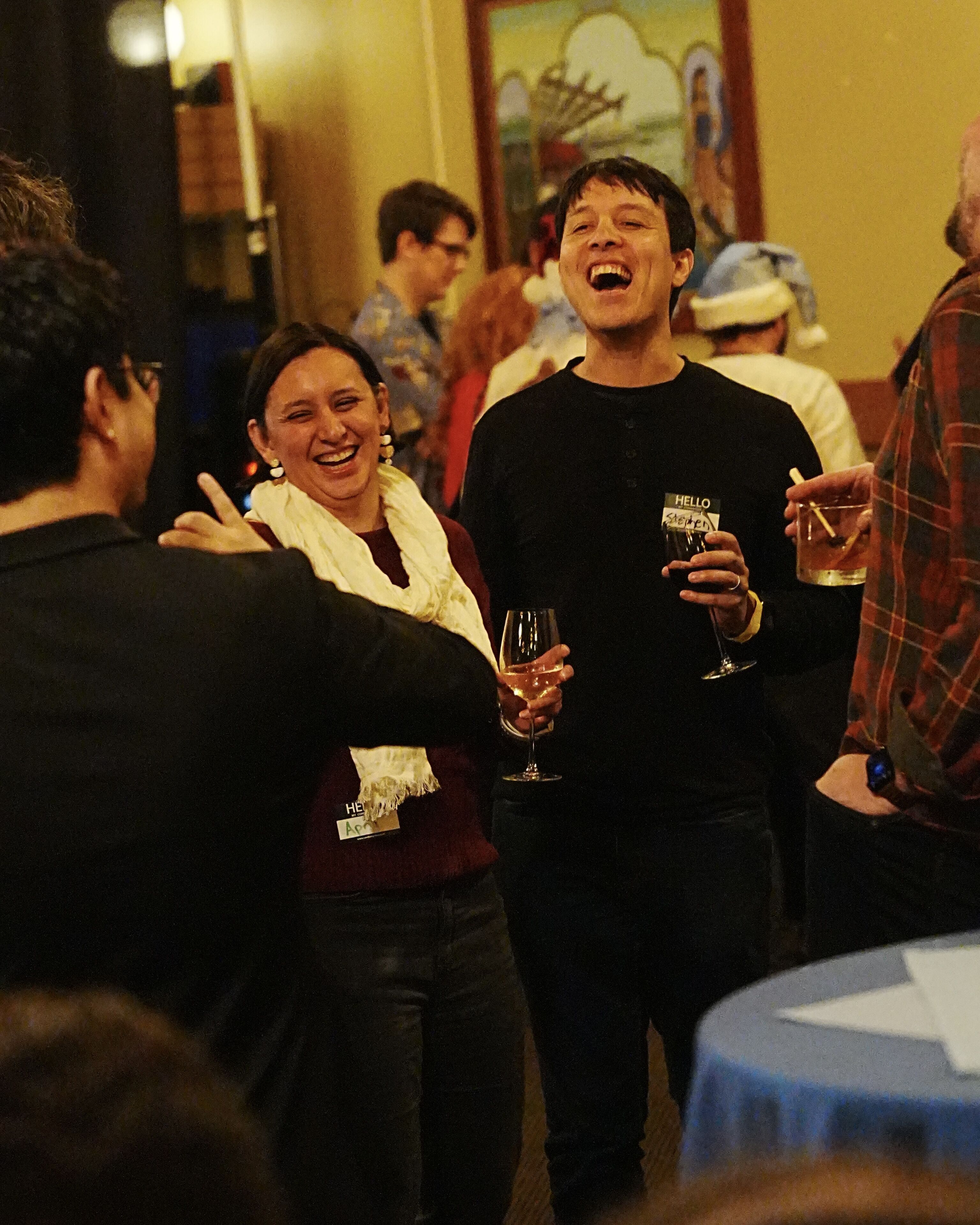 Audience is stunned and in awe of Travis doing a magic trick close up